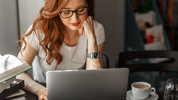 female-educator-coffee-laptop