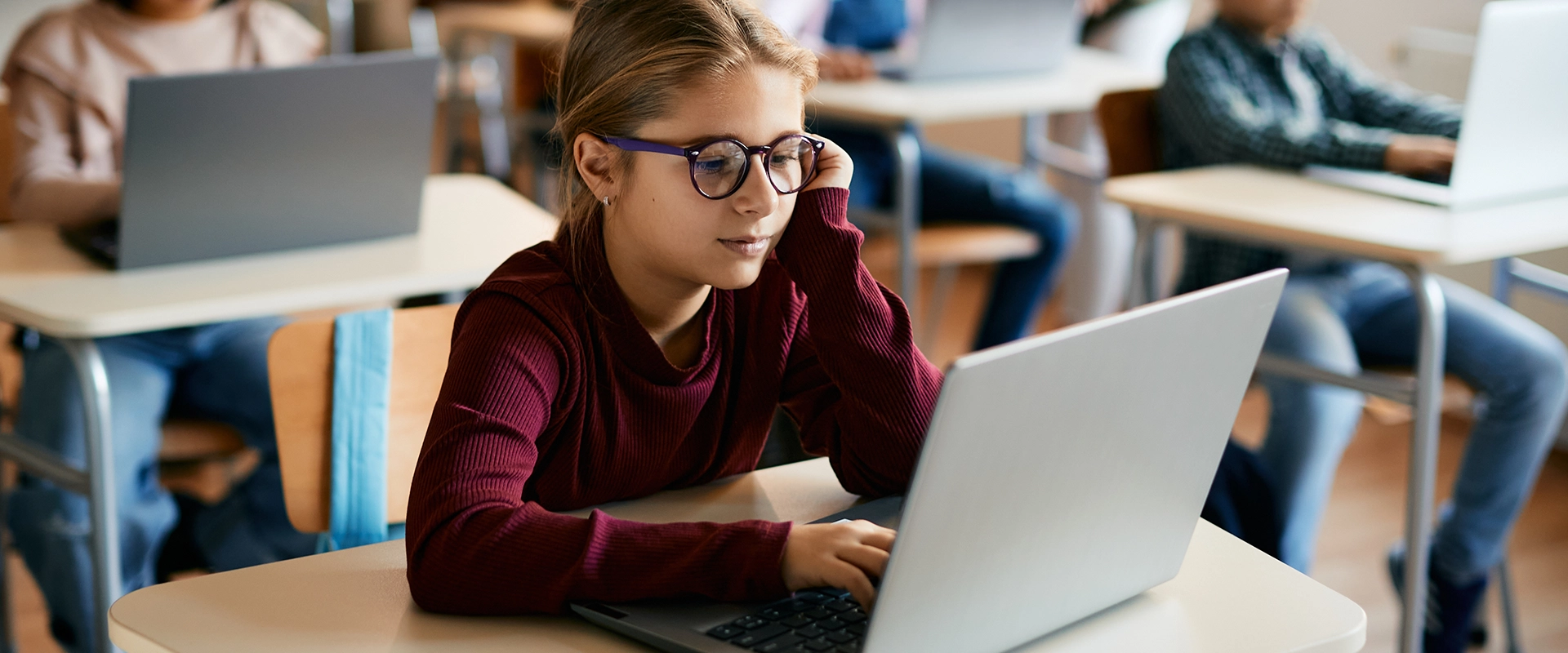 Girl-Student-Red-Shirt-Laptop-Classroom- 1920x800