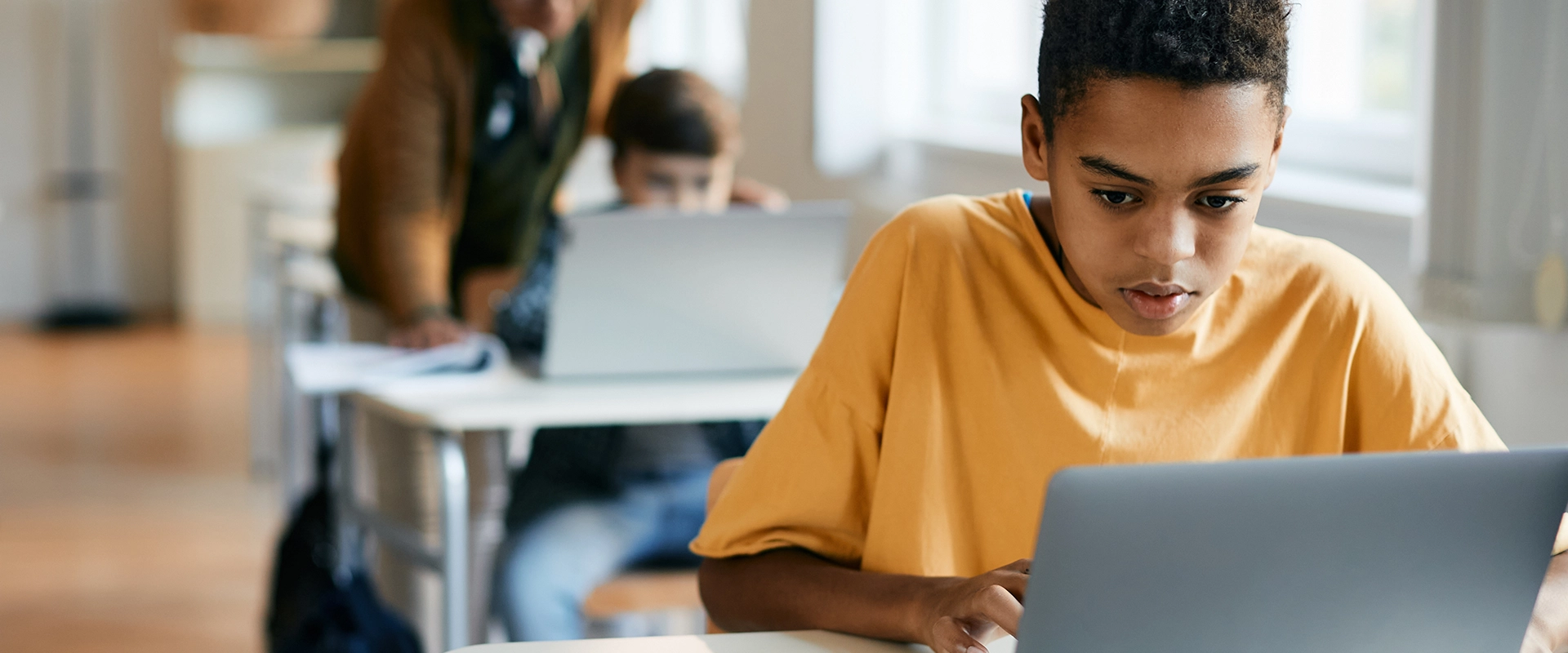 boy-elementary-student-learning-on-laptop-1920x800