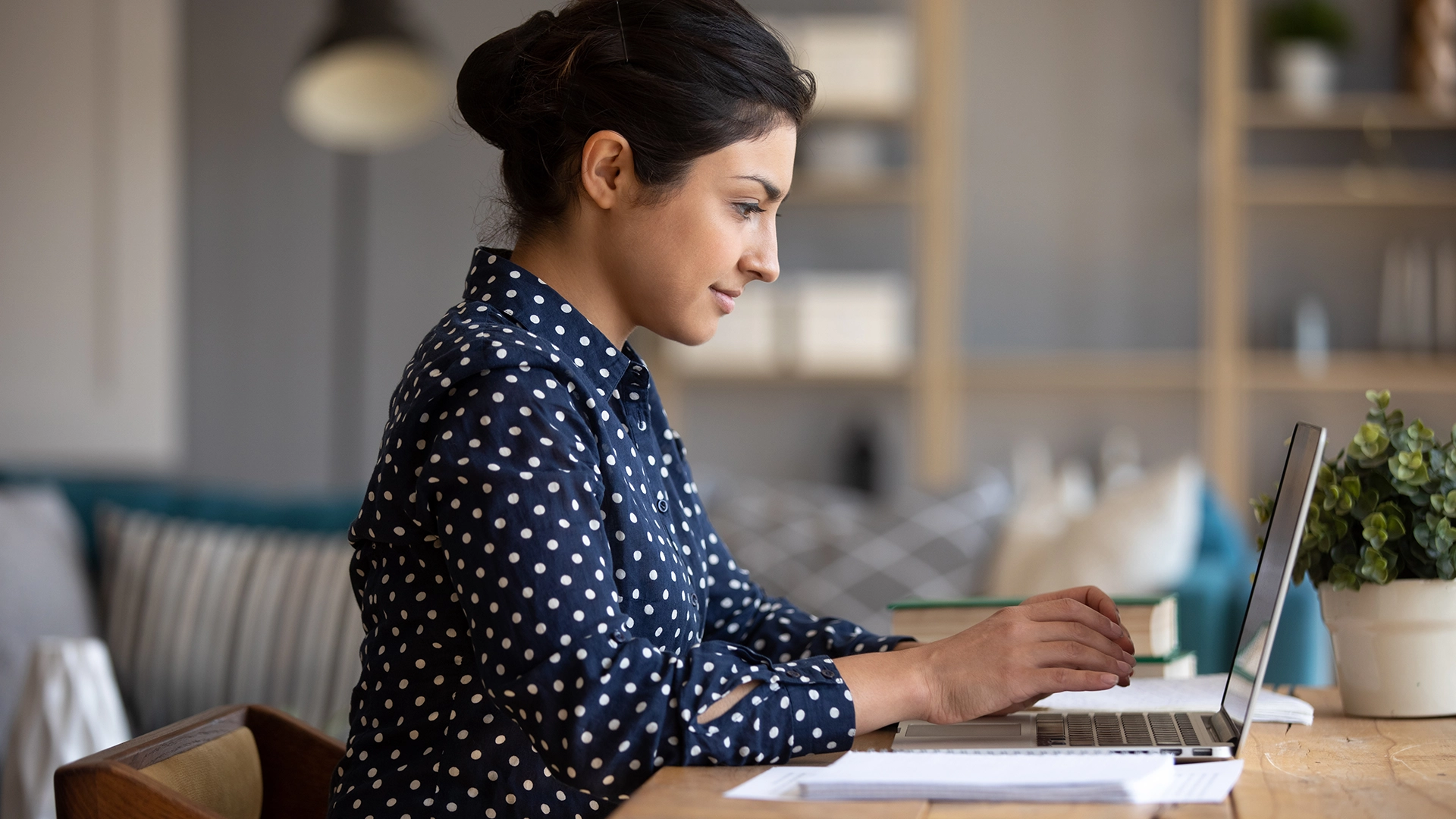 female-educator-laptop-at-home