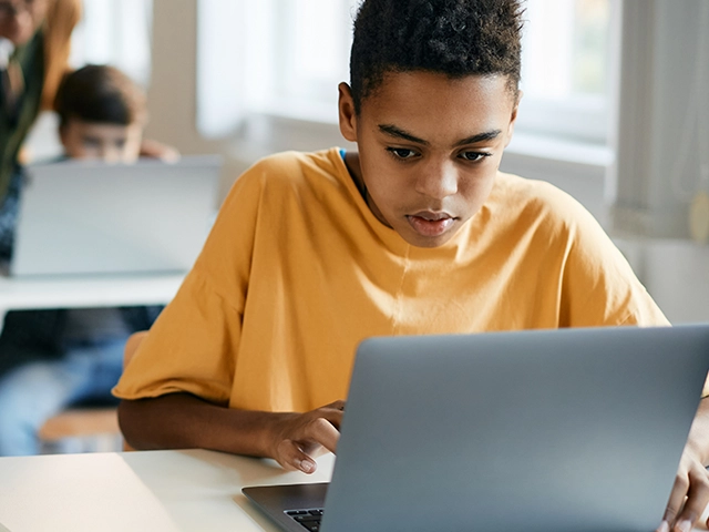 boy-elementary-student-learning-on-laptop-640x480
