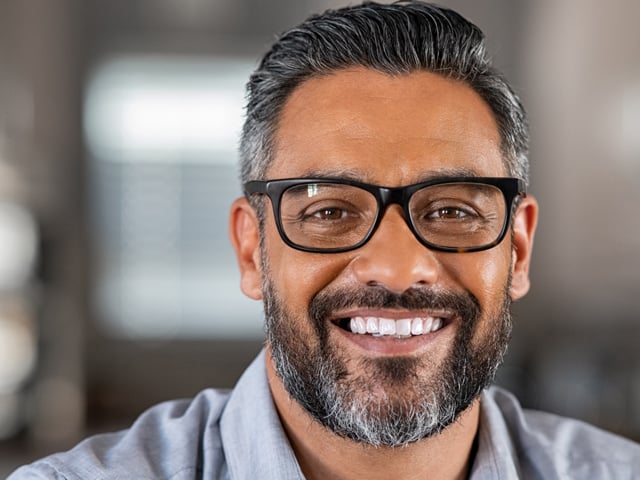 640x480 District - mature man with beard smiling at camera